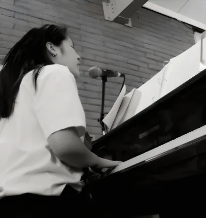 Anhthu at the piano during a ceremony